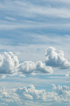 Cumulus and cirrus clouds portrait mode