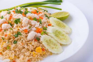 Crab meat fried rice on wooden background.