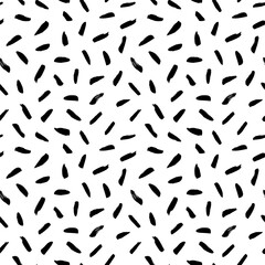 Brush strokes vector seamless pattern. Black paint freehand scribbles, dash lines, dry texture. Chaotic rough smears. Black and white mosaic texture. Hand drawn grunge ink brushstrokes.