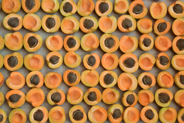 Apricots background. Apricot slices. Fresh organic fruits. Countryside garden harvest. Fruit salad, smoothie, pie and jam ingredient.