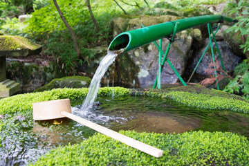 Spring water at Hatoya Hachiman shrine in Shirakawago, Gifu, Japan. a famous historic site.
