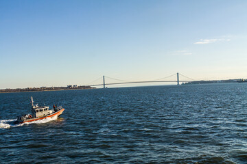 US Coast Guard and The Verranzano-Narrows Bridge on The Hudson River, New York, New York, USA