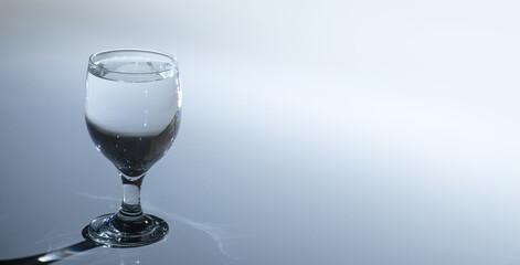 cold water is poured into a glass