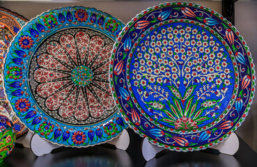 Montenegrin hand painted decorative plates with a floral pattern in at a souvenir shop in Kotor old town in Montenegro