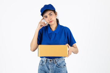 Young delivery Asian woman in blue uniform holding package over white isolated background.