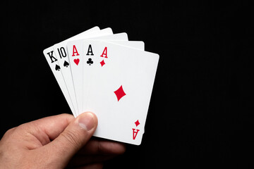 Three of a kind combination in poker on black background. Poker  combinations concept. 06.05.2020 Almaty, Kazakhstan.