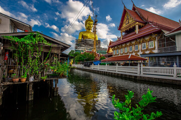 Background of a large Buddha statue in Bangkok(Wat Pak Nam Phasi Charoen),over 69 meters in height, stands majestically in the capital,a historical and cultural attraction that tourists come to see