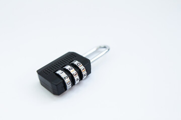 black combination lock for a suitcase on a white