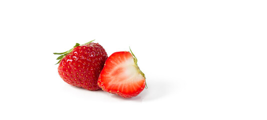 A whole and a half red organic juicy, fresh Belgian strawberry isolated on a white background with space for text.