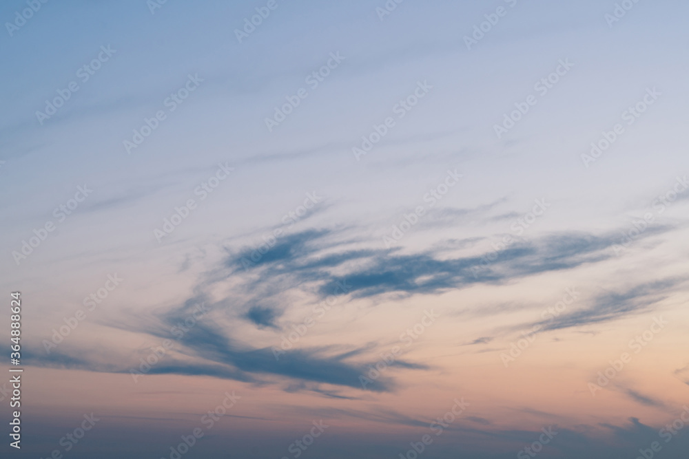 Wall mural cloudy sunset with clouds in the wind