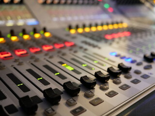 blurred of audio mixer control in studio TV station.