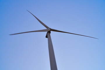 wind generators generate energy against the sky