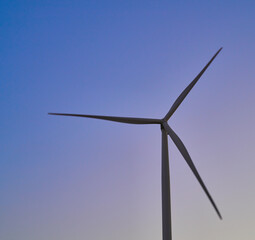 wind generators generate energy against the sky