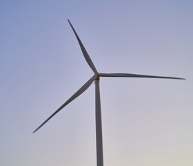 wind generators generate energy against the sky