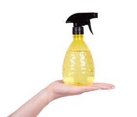 Hand with black and yellow water sprayer for cloth. Isolated on white background.
