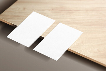 Minimalist business card mockup isolated on wooden plat background. 