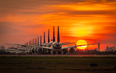 The airplane parking at sunset time,Suvarnabhumi Airport ,Bangkok ,Thailand.