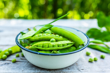 Fresh green peas in a bowl.