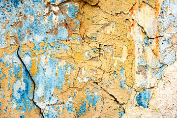 Texture of a concrete wall with cracks and scratches which can be used as a background