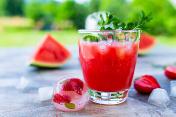 Fresh strawberry smoothie with mint and ice.