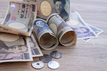 Japanese Yen money concept. A close up of the Japanese yen on a wooden table