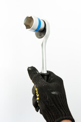 ratchet in the hand of builder on a white