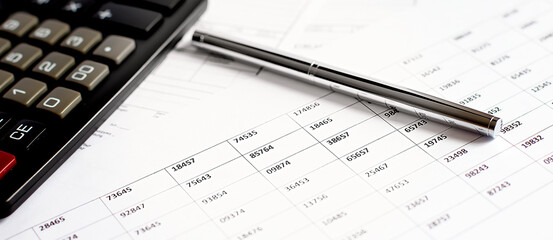 Graph Of Stock Market With Pen and calculator . business concept