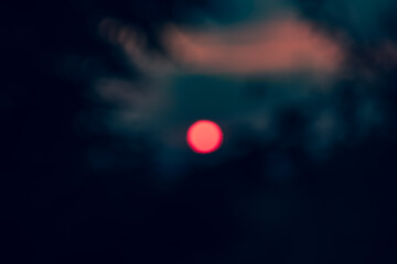 De-focused sun just over the horizon. Natural out of focus image for background.