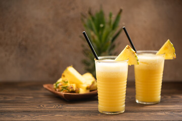 pineapple smoothie with fresh juice in glass glasses