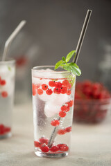 mineral water with ice and red currant berries