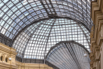 Light, openwork roof made of glass and metal in the GUM store
