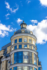 Fototapeta na wymiar Tower of the administrative building against the blue sky