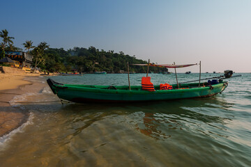 Fototapeta na wymiar Vietnamese traditional boat at the beach in sunset. Phu Quoc island,. Vietnam