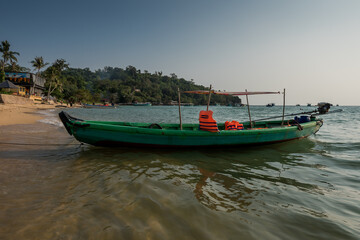 Fototapeta na wymiar Vietnamese traditional boat at the beach in sunset. Phu Quoc island,. Vietnam