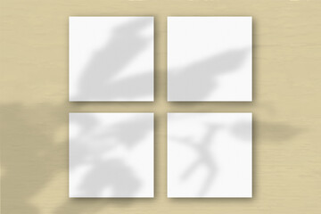 4 square sheets of white textured paper on the yellow wall background. Mockup overlay with the...