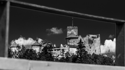 Black and white castle in Niedzica in the frame