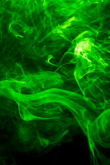 Green smoke on black background