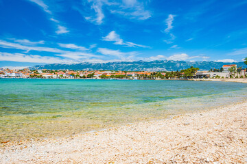 Fototapeta na wymiar Adriatic sea shore in Croatia on Pag island, beautiful sand beach in town of Novalja 