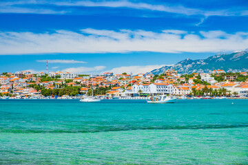 Croatia, town of Novalja on the island of Pag, marina and turquoise sea in foreground, tourist destination on Adriatic sea