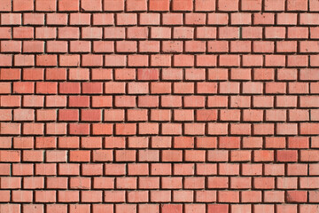 Old brick wall. Brickwork from an old brick in a rustic style. The structure and pattern of the destroyed stone wall. Copy space.