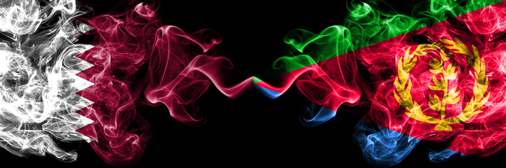 Qatar vs Eritrea smoky mystic flags placed side by side. Thick colored silky abstract smoke flags.