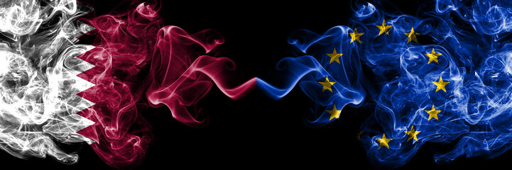 Qatar vs European Union, EU smoky mystic flags placed side by side. Thick colored silky abstract smoke flags.