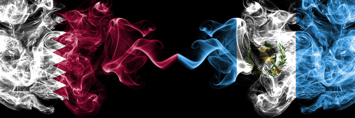 Qatar vs Guatemala, Guatemalan smoky mystic flags placed side by side. Thick colored silky abstract smoke flags.