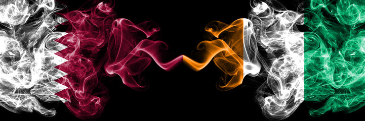 Qatar vs Ivory Coast smoky mystic flags placed side by side. Thick colored silky abstract smoke...