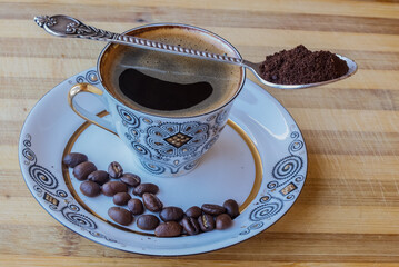 coffee Cup with coffee beans on a saucer