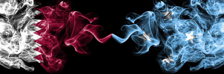 Qatar vs Micronesia, Micronesian smoky mystic flags placed side by side. Thick colored silky abstract smoke flags.