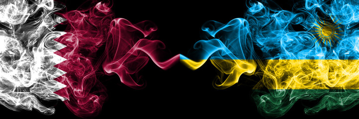 Qatar vs Rwanda, Rwandan smoky mystic flags placed side by side. Thick colored silky abstract smoke flags.