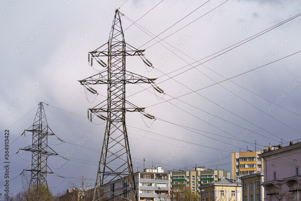 Wall mural gloomy blue dark storm sky over esidential buildings in moscow in spring. modern buildings. voltage 