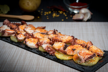 octopus board on cooked potatoes