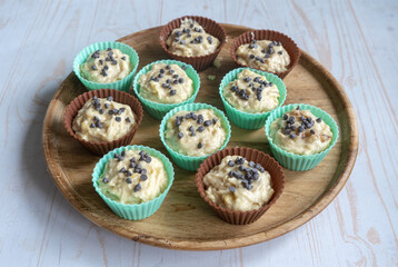 raw banana cupcakes with chocolate chips ready to  bake in silicone molds